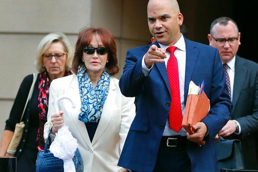 Paul Manafort's wife Kathleen Manafort, left, with defense team attorney Jay Nanavati, right, leave federal court after Manafort, the longtime political operative who for months led Donald Trump's winning presidential campaign, was found guilty of eight financial crimes in the first trial victory of the special counsel investigation into the president's associates in Alexandria, Va., Tuesday, Aug. 21, 2018. [Photo: AP/Pablo Martinez Monsivais]