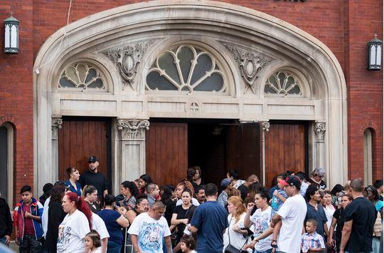 Family and friends of the Little Village fire victims gather outside of Our Lady Of Tepeyac church following funeral services in Chicago on Saturday, Sept. 1, 2018. The fire early Sunday, Aug. 26, 2018 was the city's deadliest blaze in more than a decade. It started in the rear of an apartment building during a sleepover, killing 14-year-old Cesar Contreras, 13-year-old Nathan Contreras, 11-year-old Xavier Contreras, 5-year-old Ariel Garcia, 3-month-old Amayah Almaraz and their cousin, 14-year-old Adrian Hernandez. [Photo: AP/Max Herman/Chicago Sun-Times]