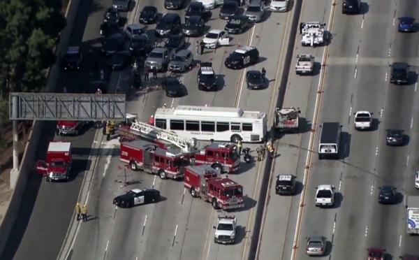 This aerial image made from video provided by KABC-TV shows the wreckage of a bus accident along Interstate 405 in Los Angeles on Sunday, Oct. 14, 2018. Authorities say at least 25 people were injured when the bus crashed into vehicles and through a concrete divider on the highway. [Photo: AP/KABC-TV]